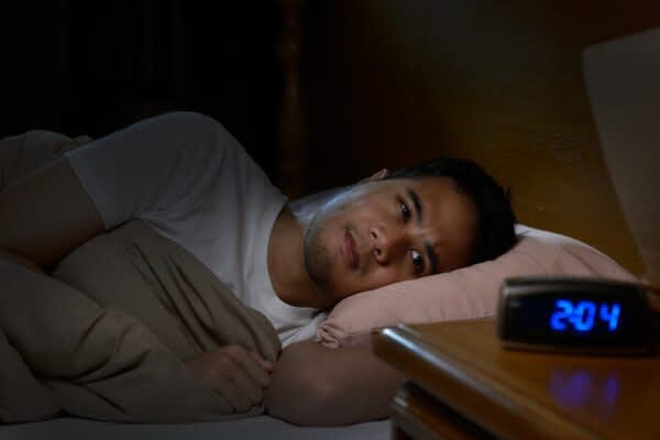 Types of Insomnia: Exploring Variations, Knowing Key Symptoms stock photo of a man experiencing insomnia