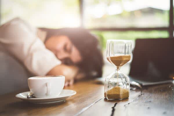 How Long Is a Power Nap? stock photo of a woman taking a power nap at her desk