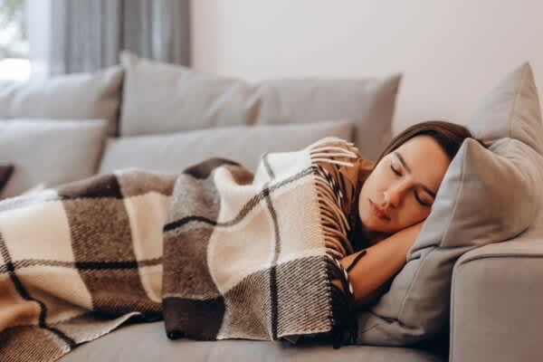 Types of Naps person taking a nap on a couch