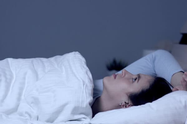 Circadian Rhythm Sleep Disorder woman lies in bed unable to sleep
